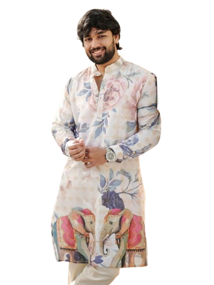 Man wearing a floral kurta with elephant motifs, smiling at camera.